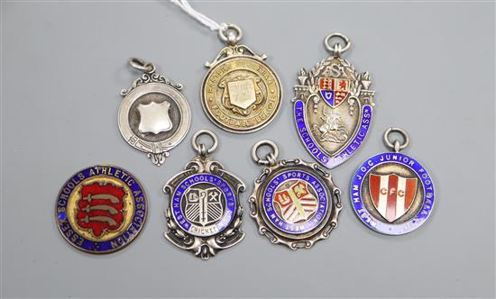 Six assorted early 20th century and later silver fob medals including enamel and football related and one other fob medal.